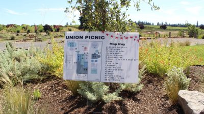Large printed outdoor event map sign Union Picnic with map key carnival rides lawn games food booths
